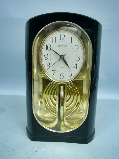 Black & Gold Swing Motion Clock by Rythum USA  