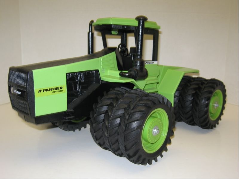 for sale is a 1/16 STEIGER CP 1400 Fargo Edition tractor with triples 