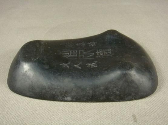 stone used by Chinese artists and calligraphers to grind dry ink and 